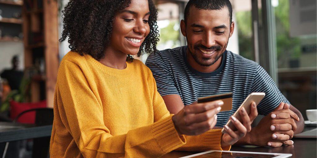 couple-paying-bill-online - Blog image for Enhance the Borrower Experience