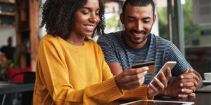 couple-paying-bill-online - Blog image for Enhance the Borrower Experience